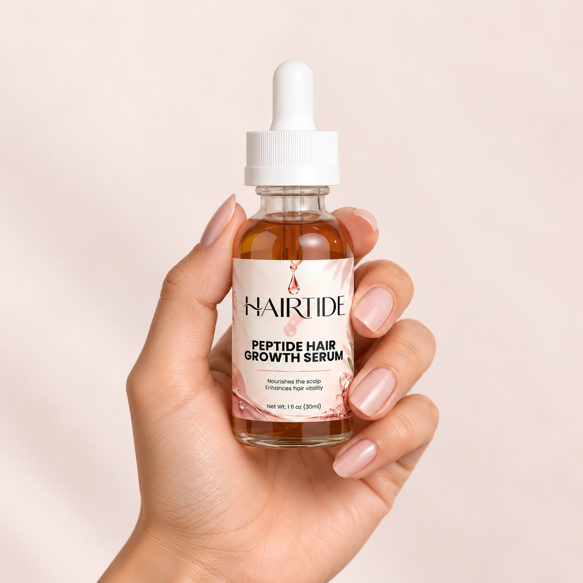 Hairtide serum bottle held in a hand, showing its size